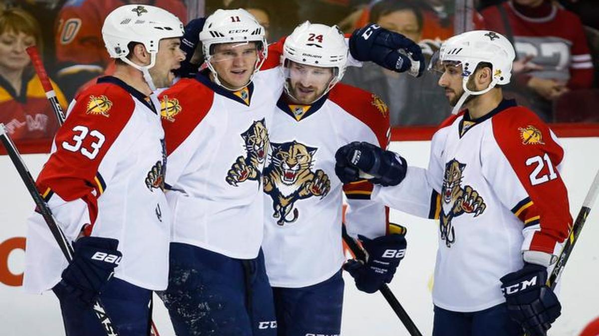 
Florida Panthers' Brad Boyes, second from right, celebrates his goal with teammates, from left, Willie Mitchell, Jonathan Huberdeau and Vincent Trocheck during the first period of an NHL hockey game against the Calgary Flames on Jan. 9, 2015, in Calgary, Alberta.
