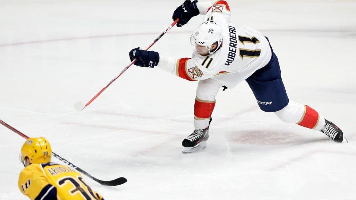 Florida Panthers left wing Jonathan Huberdeau (11) shoots and scores against the Nashville Predators during the third period of an NHL hockey game Saturday, Feb. 11, 2017, in Nashville, Tenn.