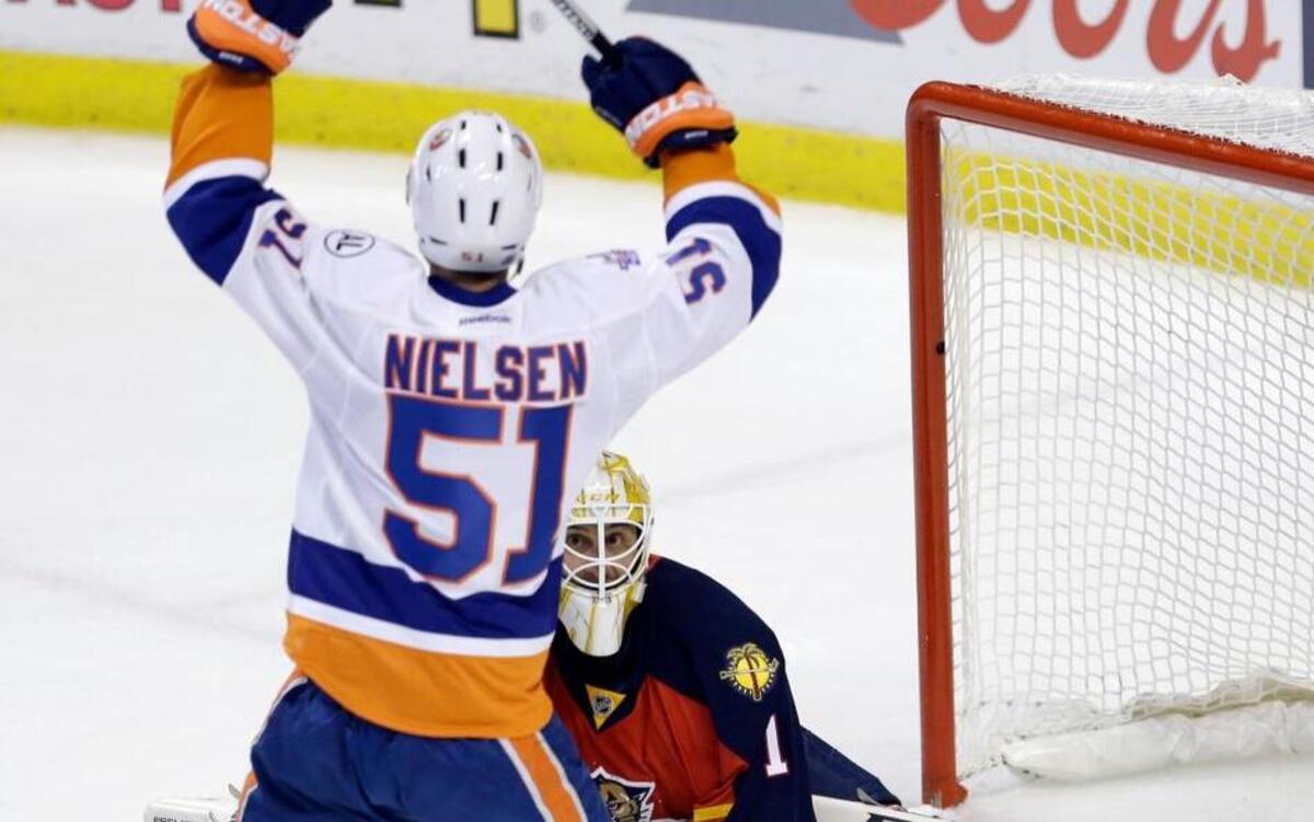 New York Islanders center Frans Nielsen (51) celebrates after scoring against Florida Panthers goalie Roberto Luongo (1) during the first period of Game 5 of an NHL hockey first-round Stanley Cup playoff series, Friday, April 22, 2016, in Sunrise, Fla.