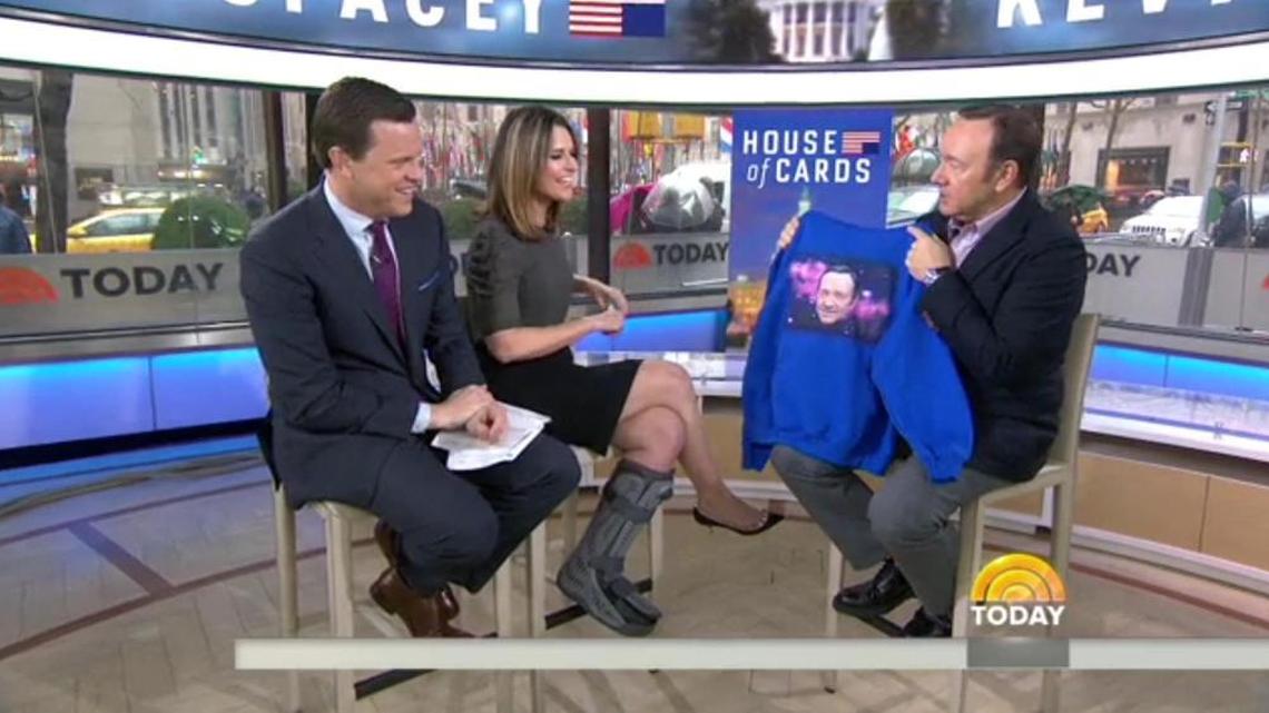 Actor Kevin Spacey, right, gets his own shirt from the ‘Today’ show’s Savannah Guthrie and Willie Geist.