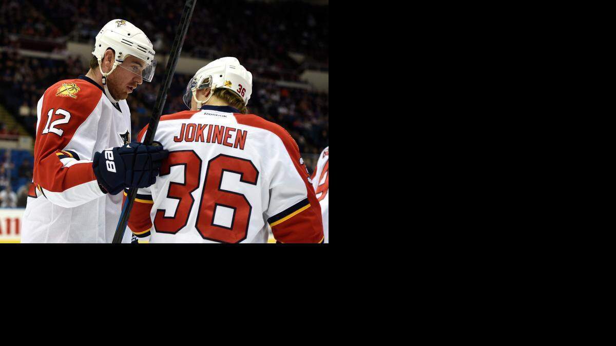 
Florida Panthers left wing Jussi Jokinen (36) and right wing Jimmy Hayes (12) celebrate Hayes's goal in the first period of an NHL hockey game against the New York Islanders at Nassau Coliseum on Tuesday, Feb. 3, 2015, in Uniondale, N.Y. (AP Photo/Kathy Kmonicek)
