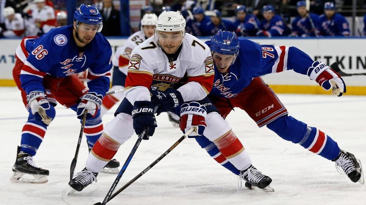 The Panthers’ Colton Sceviour (7) tries to gain control of the puck in front of the Rangers’ Brady Skjei (76) in the first period of Sunday night’s game at Madison Square Garden.