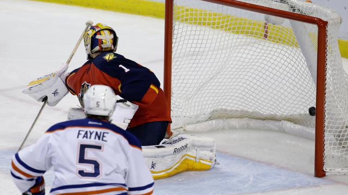 
Florida Panthers goalie Roberto Luongo (1) watches as the puck goes in the net on a goal scored by Edmonton Oilers center Matt Hendricks in the third period of an NHL hockey game at the BB&T Center in Sunrise on Jan. 17, 2015. The Oilers defeated the Panthers 3-2 in a shootout.
