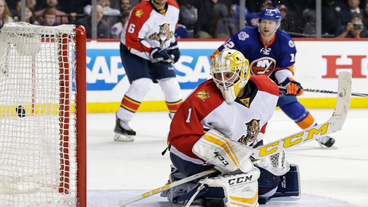 Florida Panthers goalie Roberto Luongo (1) looks back at the puck in the net after New York Islanders Thomas Hickey scored the game-winning goal during overtime in Game 3 of an NHL hockey first-round Stanley Cup playoff series, Sunday, April 17, 2016, in New York. The Islanders won 4-3.