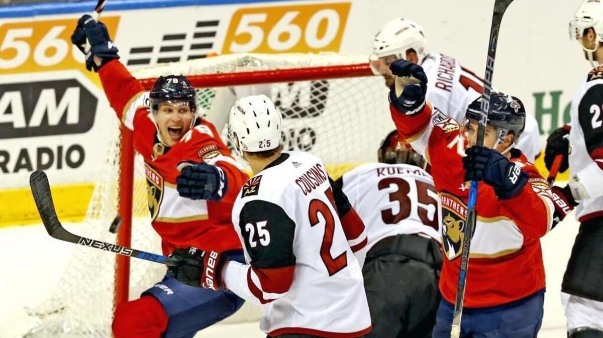 Florida Panthers Maxim Mamin (78) celebrates Denis Malgin (62) winning goal in the third period as they defeat the Arizona Coyotes at the BB&T Center in Sunrise, Florida, March 24, 2018.