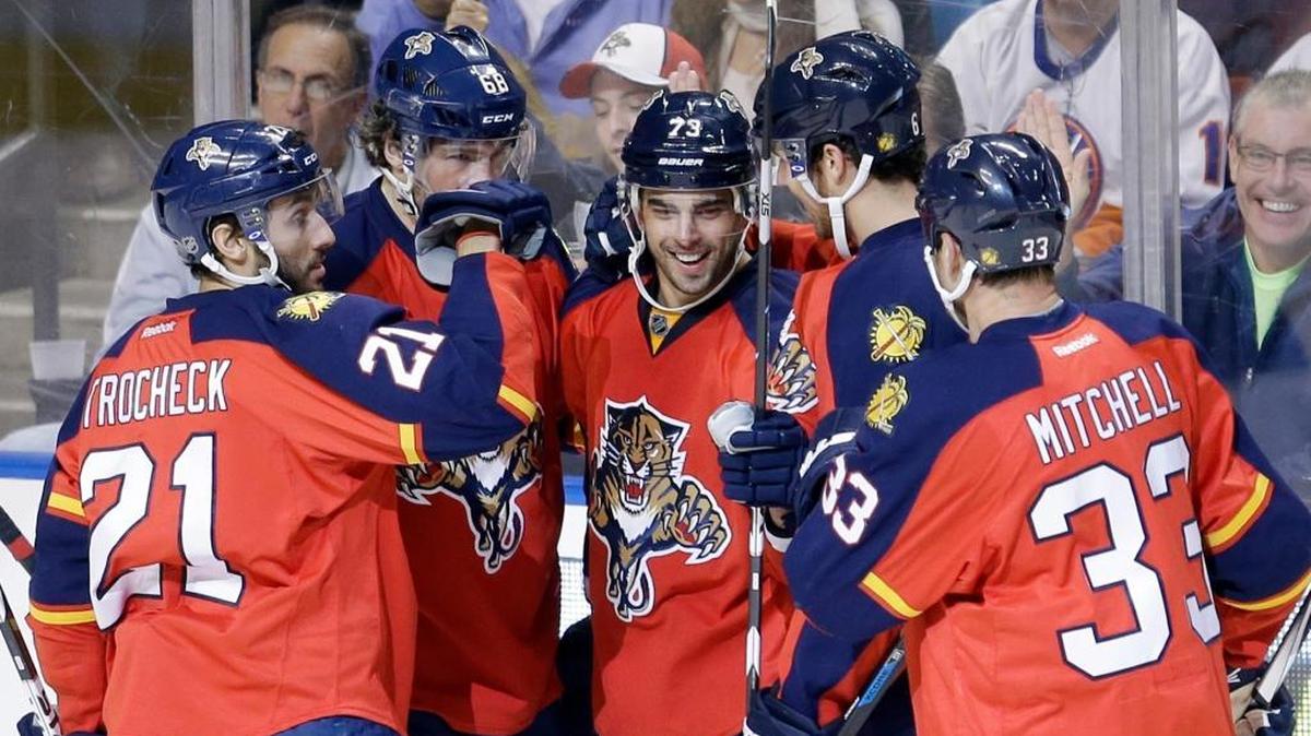 Florida Panthers center Brandon Pirri (73) is congratulated by teammates after scoring against the New York Islanders during the first period Friday, Nov. 27, 2015, in Sunrise, Fla.