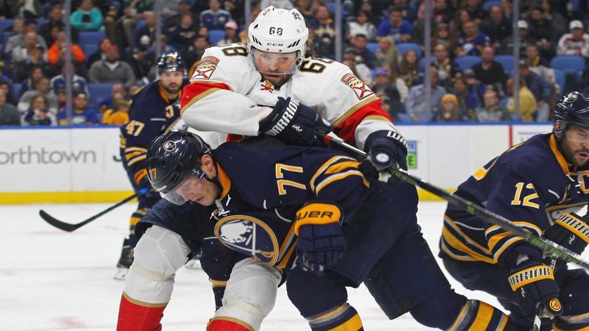 The Sabres’ Dmitry Kulikov (77), a former Panther, collides with Jaromir Jagr (68) during Saturday afternoon’s game in Buffalo.