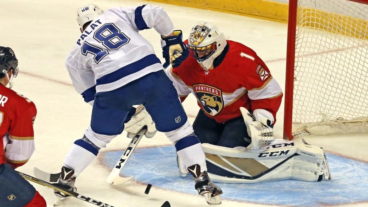 Florida Panthers goalie Roberto Luongo (1) blocks Tampa Bay Lightning’s Ondrej Palat (18) in the first period Tuesday, Sept. 26, 2017, at the BB&T Center in Sunrise, Fla.