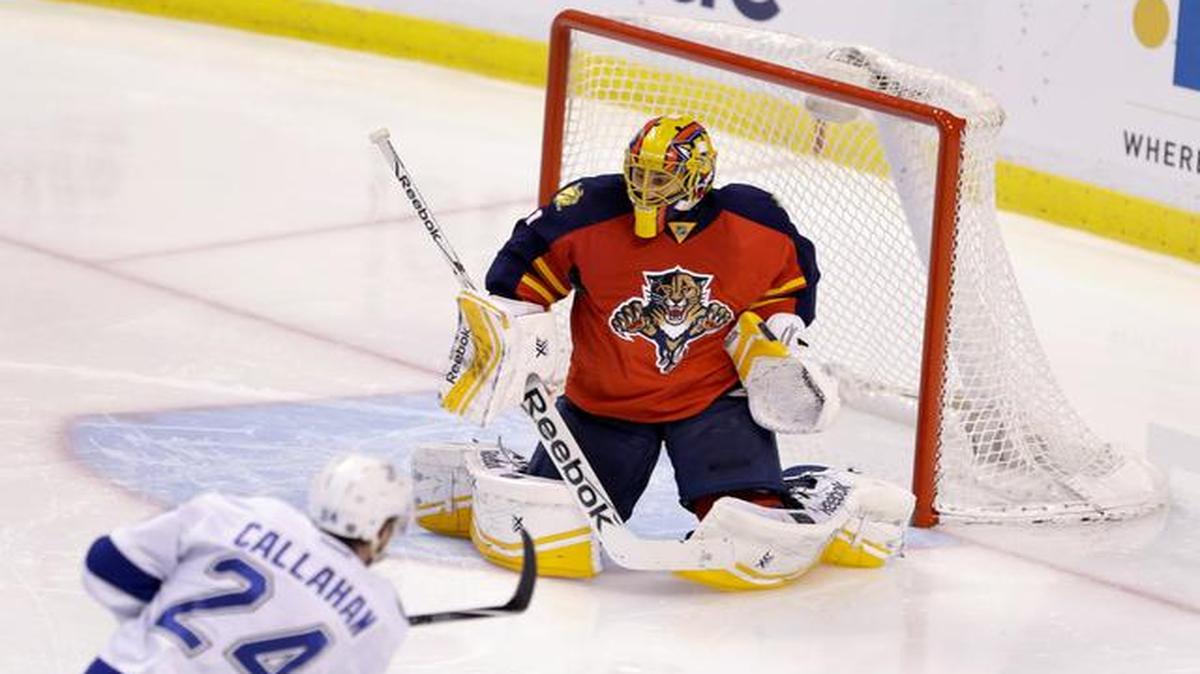
Tampa Bay Lightning right wing Ryan Callahan (24) scores a goal against Florida Panthers goalie Roberto Luongo during the third period of an NHL hockey game at BB&T Center in Sunrise on April 4, 2015. The Lightning defeated the Panthers 4-0.
