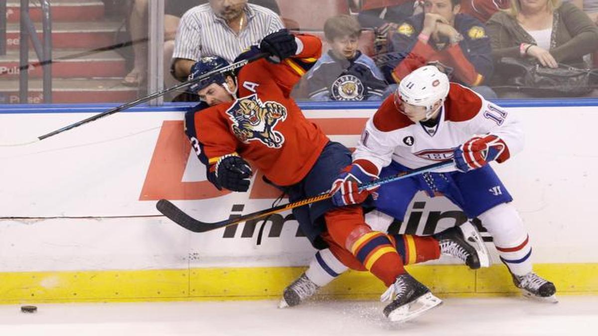 
Montreal Canadiens right wing Brendan Gallagher (11) and Florida Panthers center Dave Bolland (63) battle for the puck during the third period of an NHL hockey game, Sunday, April 5, 2015 in Sunrise, Fla. The Canadiens defeated the Panthers 4-1. 
