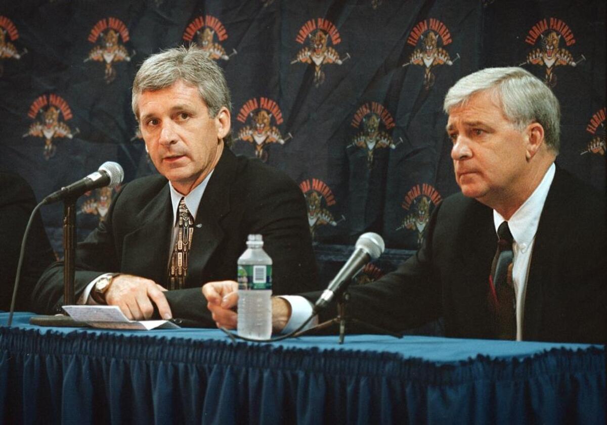 Florida Panthers general manager Bryan Murray (right) introduces his brother Terry as the new coach of the team on June 21, 1998.
