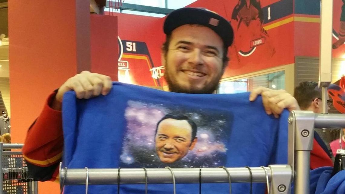 Shawn Hawkins of Deerfield Beach grabs his Kevin Spacey ‘Spacey In Space’ hooded sweatshirt at the Panthers’ team store on Tuesday night at BB&T Center.