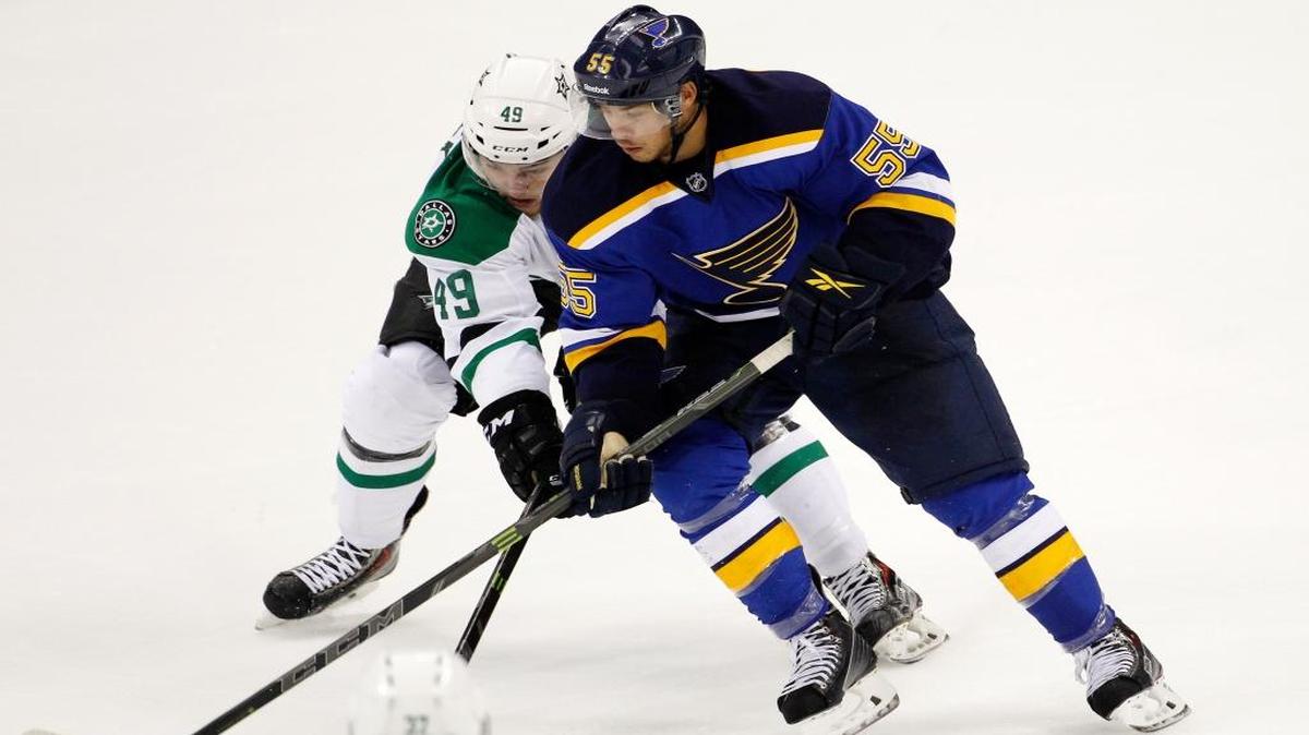 Brent Regner, right, battles for control of the puck in the third period of a preseason NHL hockey game at the Sprint Center in Kansas City, Mo., Saturday, Sept. 27, 2014.