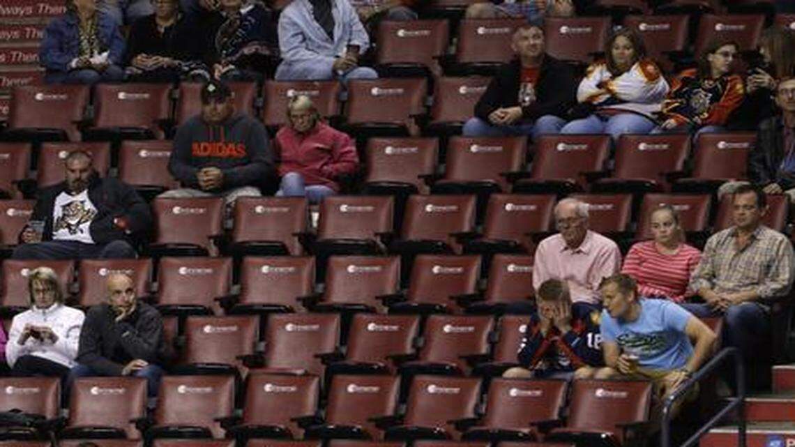 
Hockey fans look on during the third period of an NHL hockey game between the Florida Panthers and the Ottawa Senators, Monday, Oct. 13, 2014 in Sunrise.


