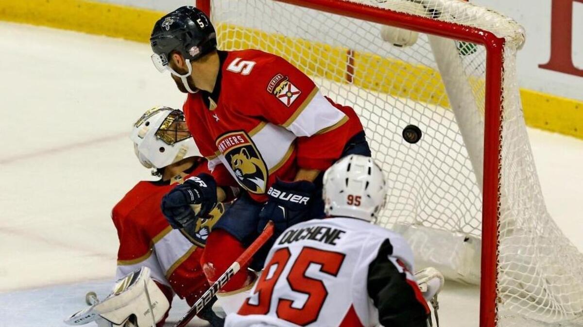 Florida Panthers goalie Roberto Luongo (1) and Aaron Ekblad (5) can't stop Ottawa Senators Matt Duchene (5) from scoring the winning goal to defeat the Panthers in the third period at the BB&T Center in Sunrise, Florida, March 12, 2018.