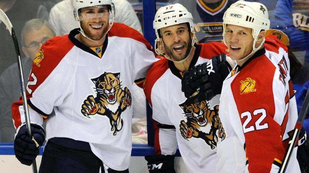 Florida Panthers' Derek MacKenzie, center, celebrates his goal against the St. Louis Blues with teammates Quinton Howden (42) and Shawn Thornton (22) during the second period Tuesday, Dec. 1, 2015, in St. Louis. The Panthers won 3-1.