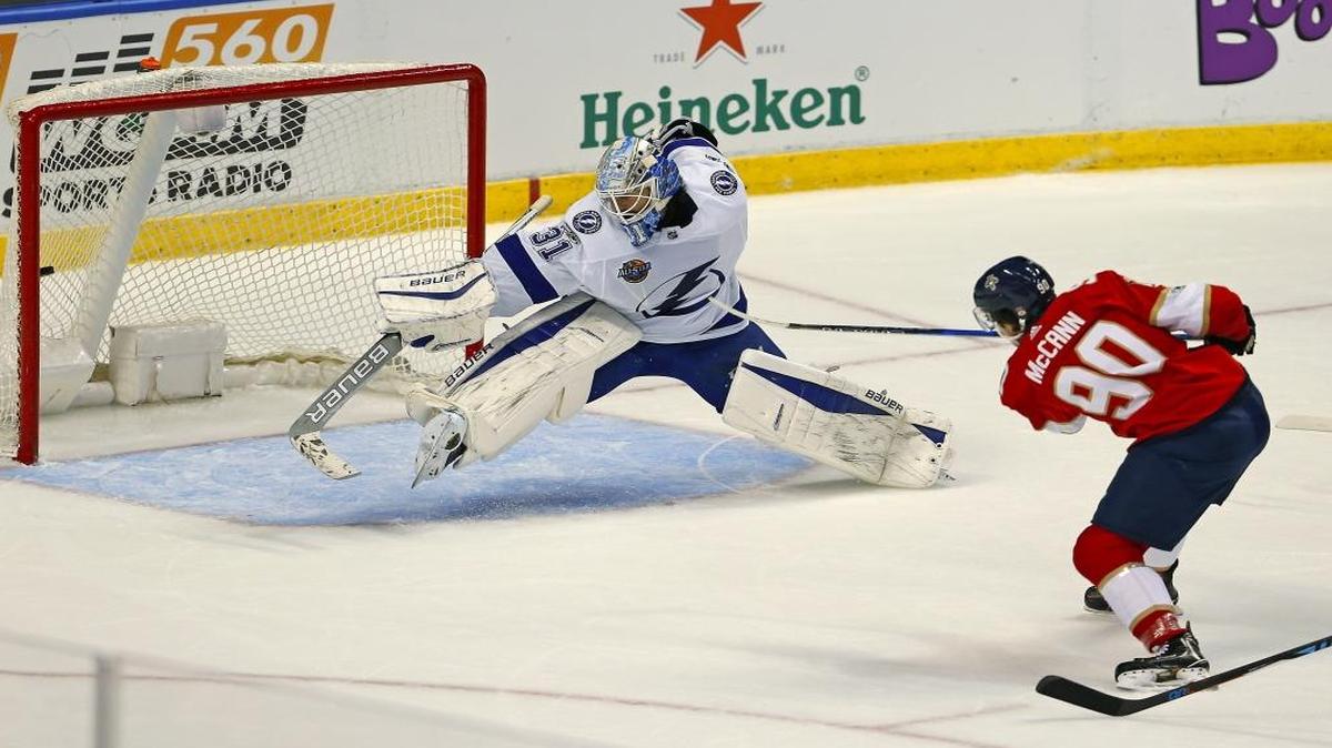Florida Panthers center Jared McCann scores against Tampa Bay Lightning goalie Peter Budaj during the first period of an NHL preseason hockey game at the BB&T Center on Thurs., Sept. 28, 2017 in Sunrise.