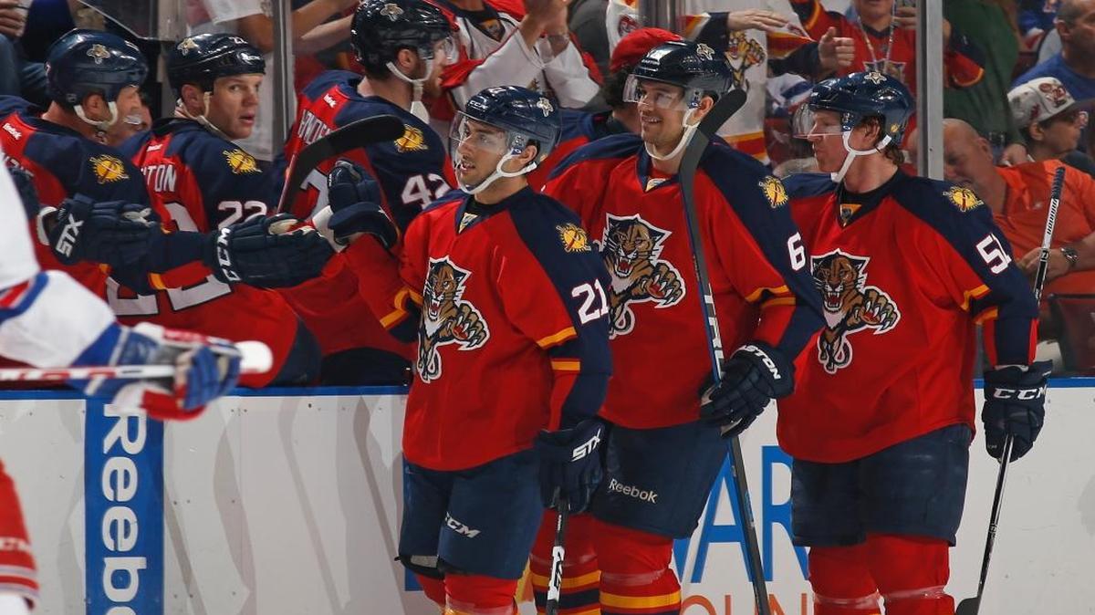 Florida Panthers forward Vincent Trocheck (21) is congratulated by teammates after scoring a goal against the New York Rangers during the second period of an NHL hockey game, Saturday, Jan. 2, 2016, in Sunrise, Fla.