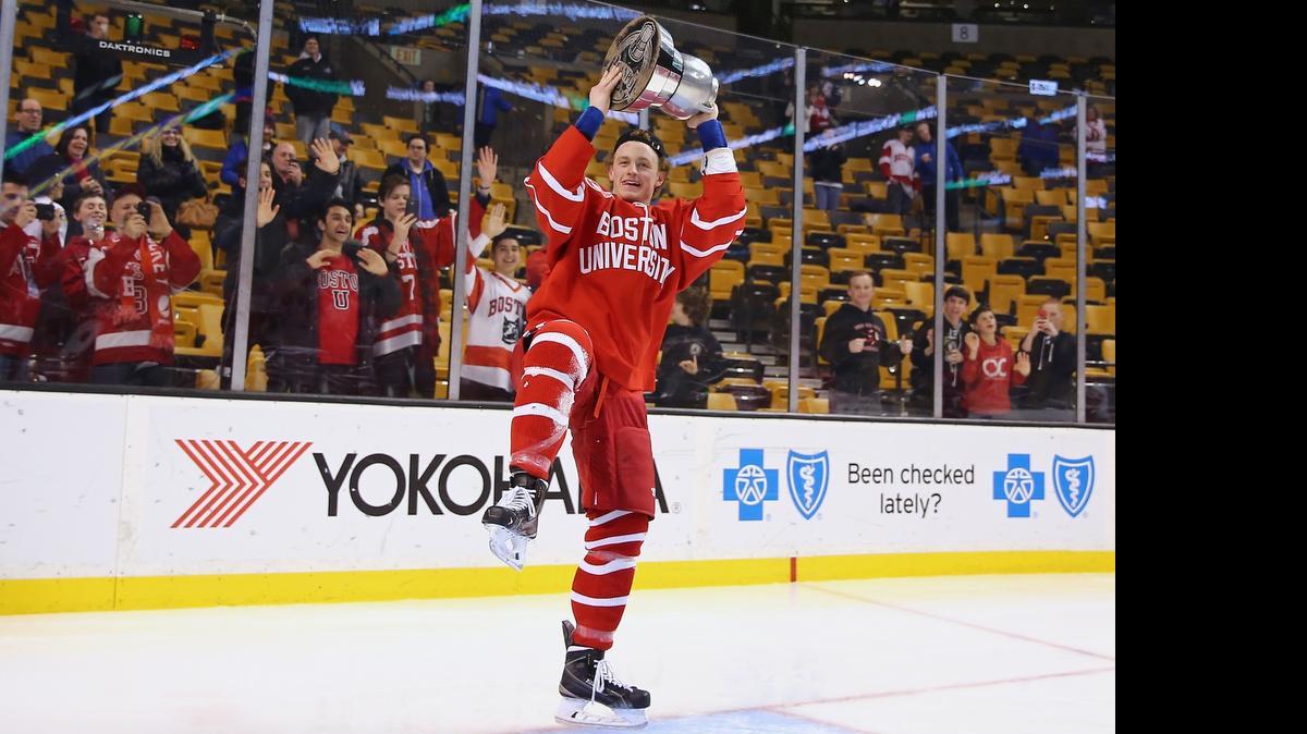
Jack Eichel of Boston University celebrates with the Beanpot trophy following a 4-3 win over Northeastern at the 2015 Beanpot Tournament Championship game at TD Garden on Feb. 23, 2015 in Boston. 
