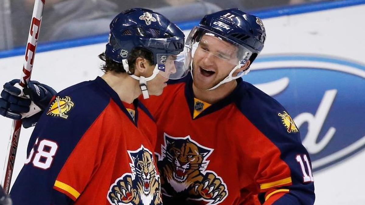 
Florida Panthers center Jonathan Huberdeau (11) celebrates with right wing Jaromir Jagr (68) after Jagr scored his second goal of the game during the first period of an NHL hockey game against the Buffalo Sabres, Thursday, Oct. 15, 2015 in Sunrise, Fla. 
