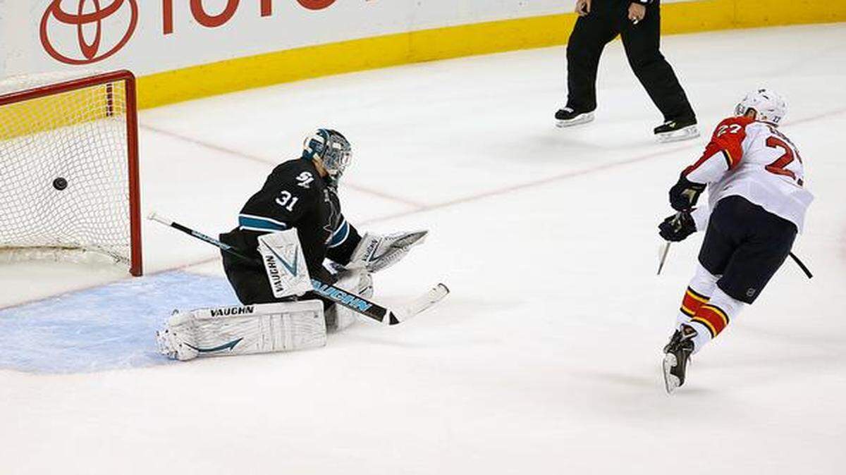 
Florida Panthers center Nick Bjugstad (27) scores a goal past San Jose Sharks goalie Antti Niemi (31), of Finland, during a shootout of an NHL hockey game Thursday, Nov. 20, 2014, in San Jose, Calif. The Panthers won 3-2 in a shootout.
