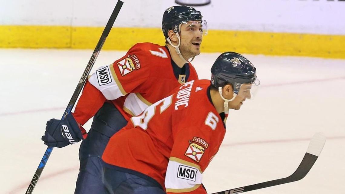 Florida Panthers’ Colton Sceviour (7) skates away with Alexander Petrovic (6) who just scored the winning goal in the third period as they play the Carolina Hurricanes Monday, April 2, 2018, at the BB&T Center in Sunrise, Fla.