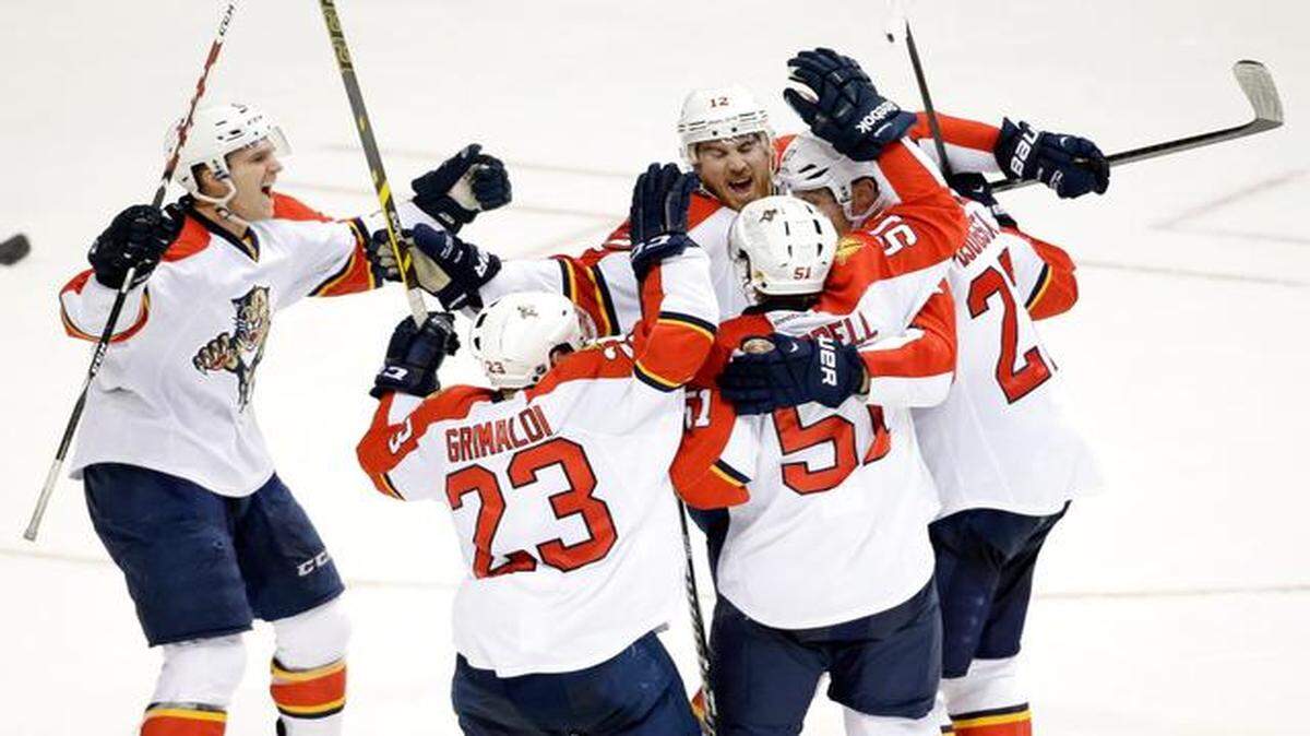 
Florida Panthers center Nick Bjugstad (27), right, is congratulated by teammates after he scored a goal to tie the game against the Nashville Predators with 31 seconds left in the third period of an NHL hockey game Saturday, Nov. 22, 2014, in Nashville, Tenn. The Predators went on to win 3-2 in a shootout.
