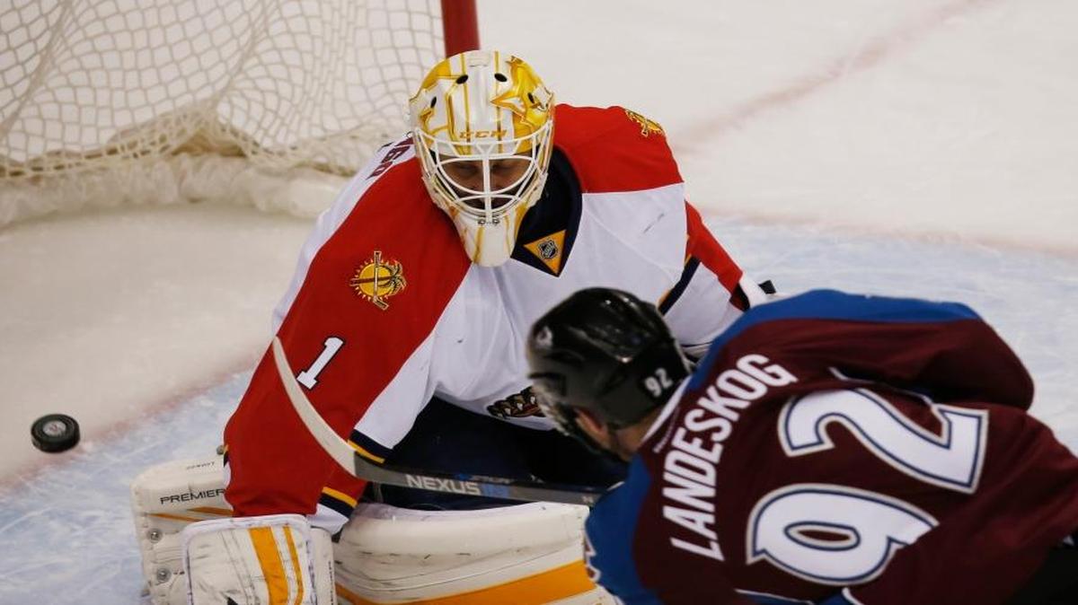 Colorado Avalanche left wing Gabriel Landeskog, front, of Sweden, scores a goal past Florida Panthers goalie Roberto Luongo in the first period of an NHL hockey game Thursday, March 3, 2016, in Denver.