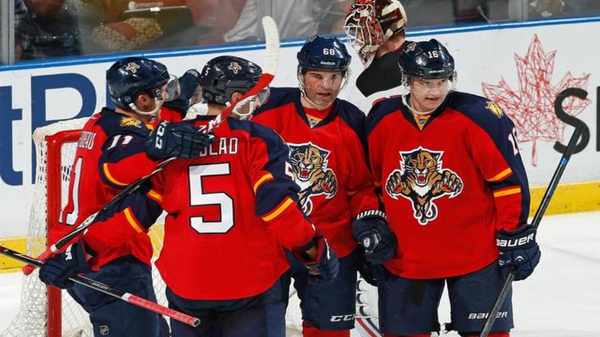 
Florida Panthers forward Jaromir Jagr (68) celebrates his winning goal with teammates Aaron Ekblad, Aleksander Barkov and Jonathan Huberdeau during the third period of an NHL hockey game against th New Jersey Devils, Saturday, April 11, 2015, in Sunrise, Fla. The Panthers defeated the Devils 3-2. 
