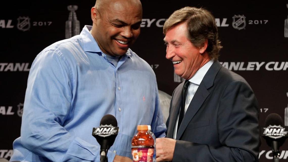 Hockey great Wayne Gretzky, right, greets former NBA player Charles Barkley, left, during a news conference before Game 4 of the NHL hockey Stanley Cup Finals between the Nashville Predators and the Pittsburgh Penguins on Monday.