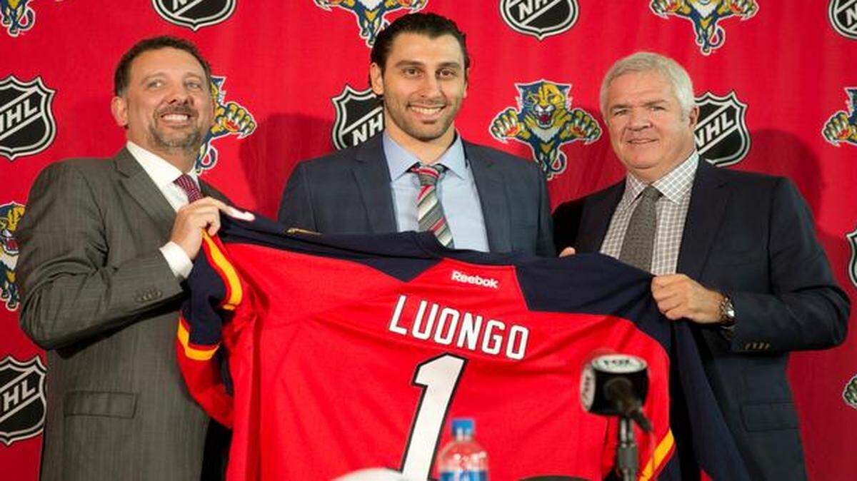 
Roberto Luongo, center, is shown with CEO/president Rory Babish, left, and GM Dale Tallon on Wednesday, March 5, 2014 after returning to the Florida Panthers following a trade with the Vancouver Canucks.
