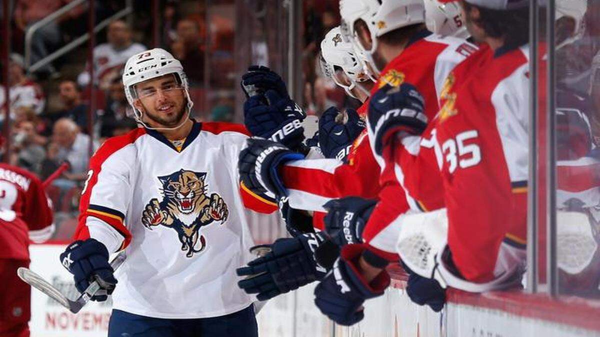 
Brandon Pirri of the Florida Panthers celebrates with teammates on the bench after scoring a third-period goal against the Arizona Coyotes at Gila River Arena on October 25 in Glendale, Arizona. 
