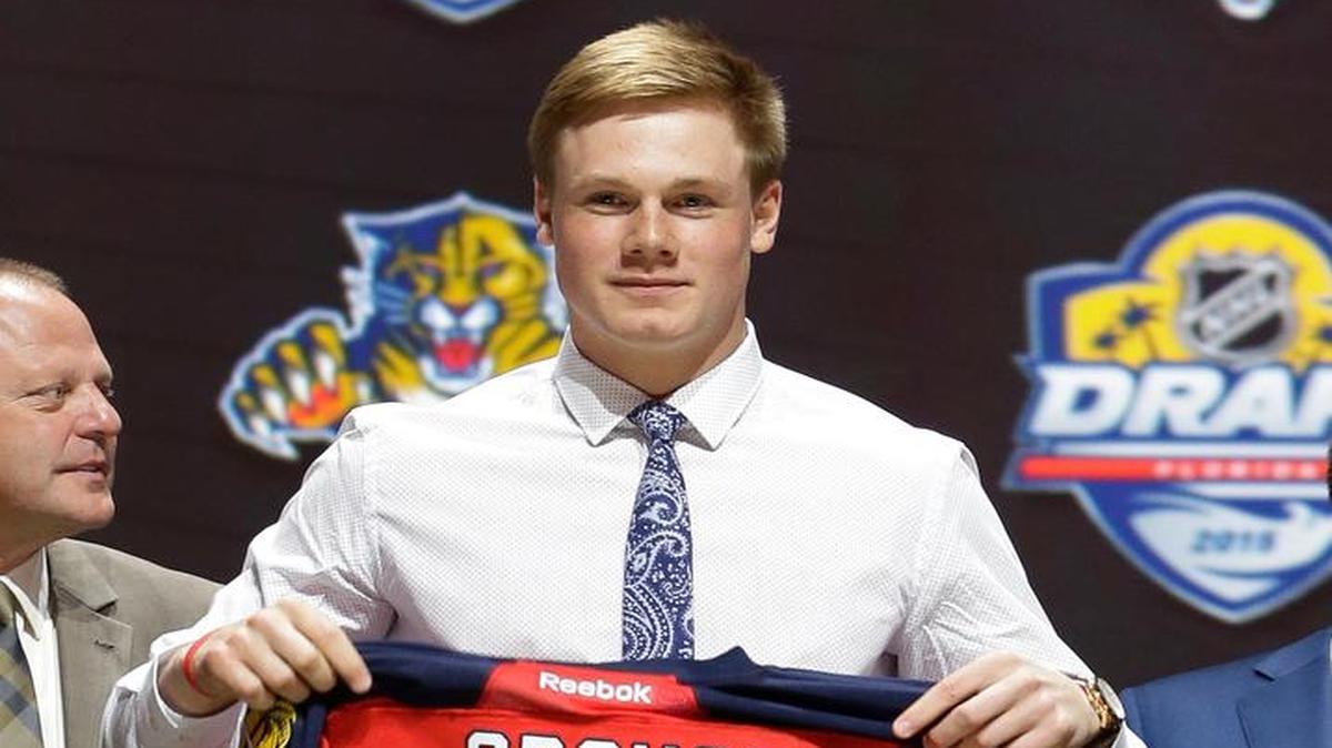 
Lawson Crouse holds up a Florida Panthers sweater after being chosen 11th overall during the first round of the NHL hockey draft, Friday, June 26, 2015, in Sunrise, Fla. 
