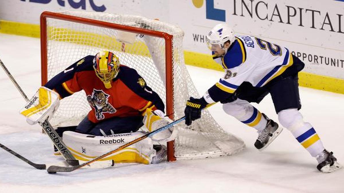 
Florida Panthers goalie Roberto Luongo (1) blocks a shot by St. Louis Blues center Patrik Berglund (21) during the first period of an NHL hockey game in Sunrise, Fla., Sunday, Feb. 15, 2015. 
