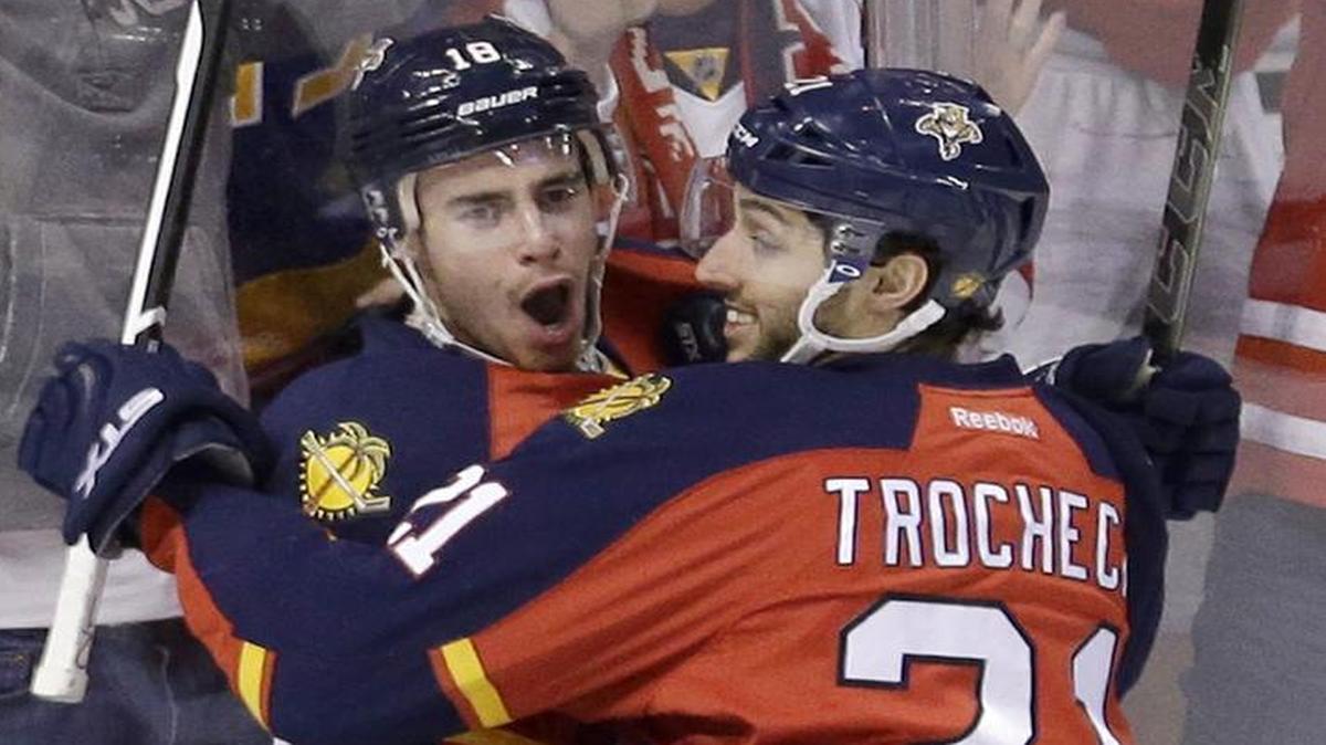 Florida Panthers right wing Reilly Smith (18) is congratulated by teammate Vincent Trocheck (21) after scoring against the Chicago Blackhawks during the first period Friday, Jan. 22, 2016, in Sunrise, Fla.