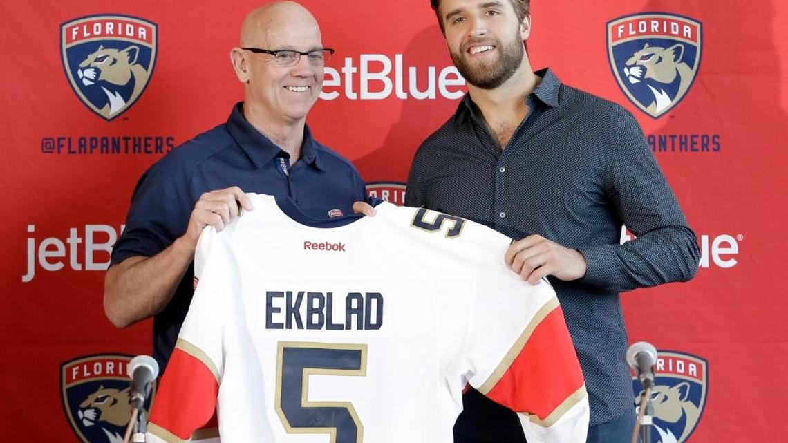 Florida GM Tom Rowe poses with Aaron Ekblad after the 20-year-old defenseman signed an eight-year, $60-million extension with the Panthers in July.
