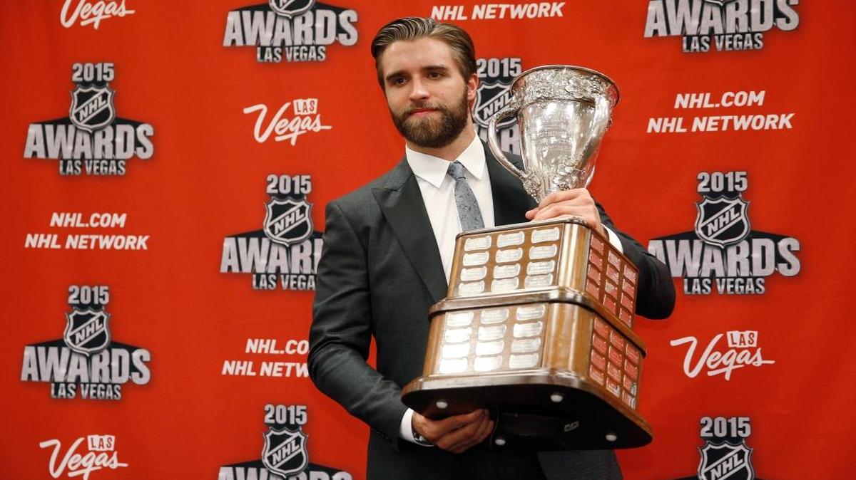 Florida Panthers' Aaron Ekblad poses with the Calder Memorial Trophy after winning the award at the NHL Awards show Wed., June 24, 2015, in Las Vegas.