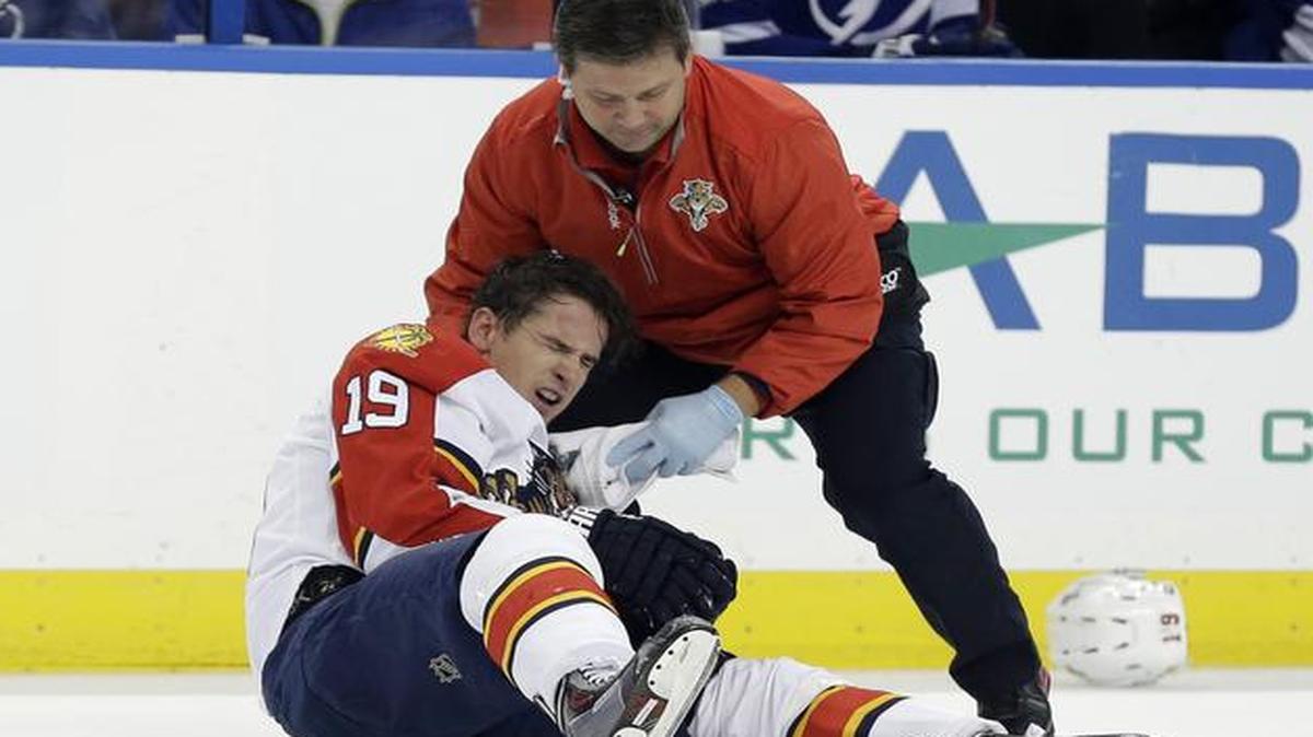 
Florida Panthers right wing Scottie Upshall is helped by a trainer after getting hurt against the Tampa Bay Lightning during the second period Thursday, Oct. 9, 2014, in Tampa, Fla. 
