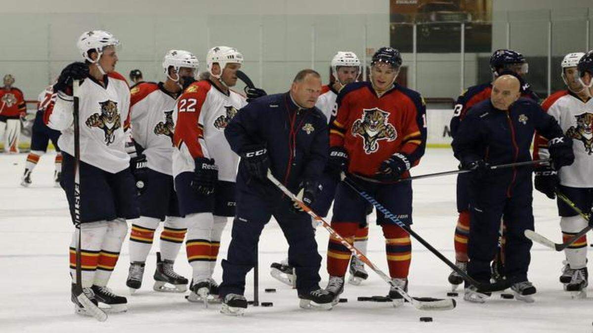 
Florida Panthers head coach Gerard Gallant, center, runs drills with the players during hockey training camp, Monday, Sept. 21, 2014, in Coral Springs, Fla.
