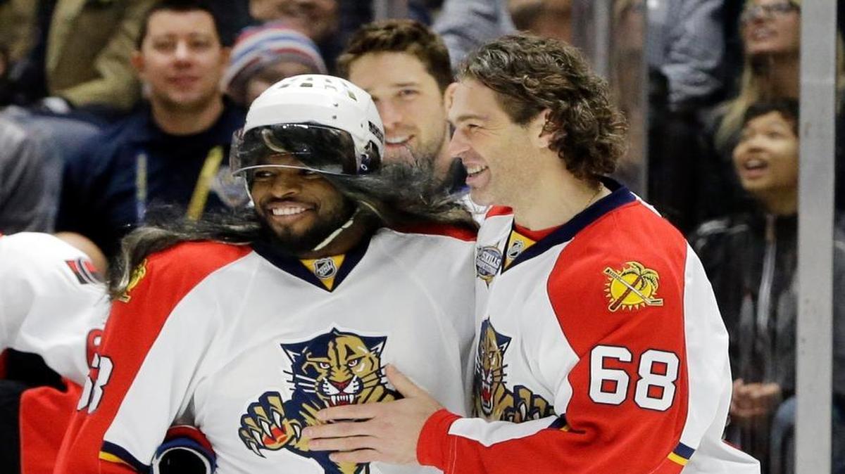 Montreal Canadiens defenseman P. K. Subban, left, wearing a wig and a Jaromir Jagr jersey, is congratulated by Florida Panthers forward Jaromir Jagr after Subban competed in the breakaway challenge at the NHL hockey All-Star game skills competition Saturday, Jan. 30, 2016, in Nashville, Tenn.