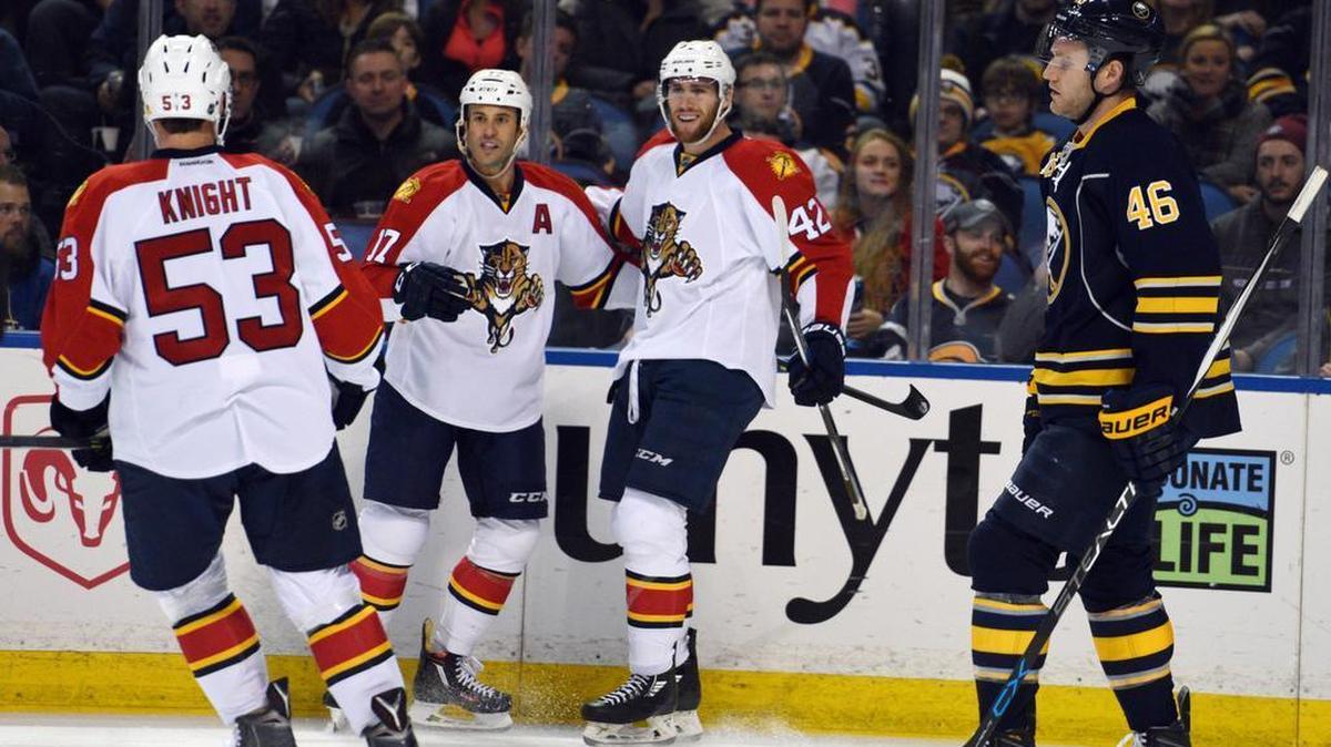Florida Panthers' Corban Knight (53), Derek MacKenzie (17), and Quinton Howden (42) celebrate a goal by MacKenzie as Buffalo Sabres' Cody Franson (46) reacts during the second period Tuesday, Jan. 5, 2016 in Buffalo, N.Y.