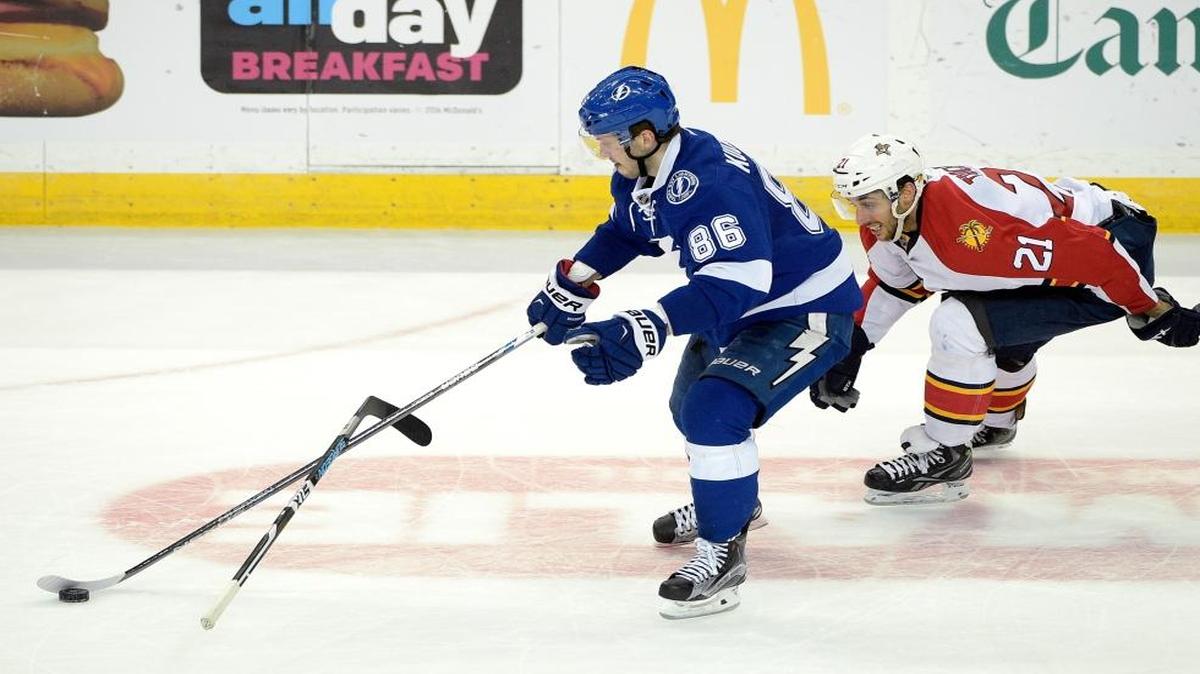 Florida Panthers center Vincent Trocheck (21) throws his stick in front of Tampa Bay Lightning right wing Nikita Kucherov (86), of Russia, as Kucherov goes on to score an open-net goal during the third period of an NHL hockey game in Tampa, Fla., Sunday, Jan. 17, 2016.