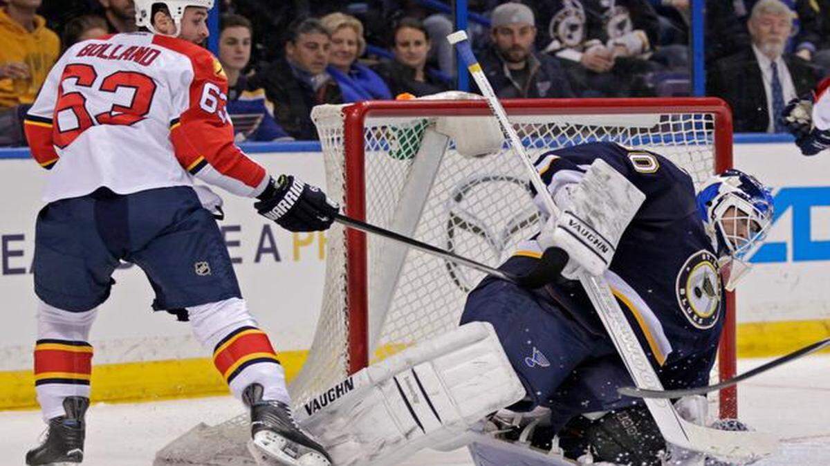 
St. Louis Blues goalie Martin Brodeur (30) makes a stick save on a shot from Florida Panthers' Dave Bolland (63) in the first period of an NHL hockey game, Monday, Dec. 8, 2014, in St. Louis. 
