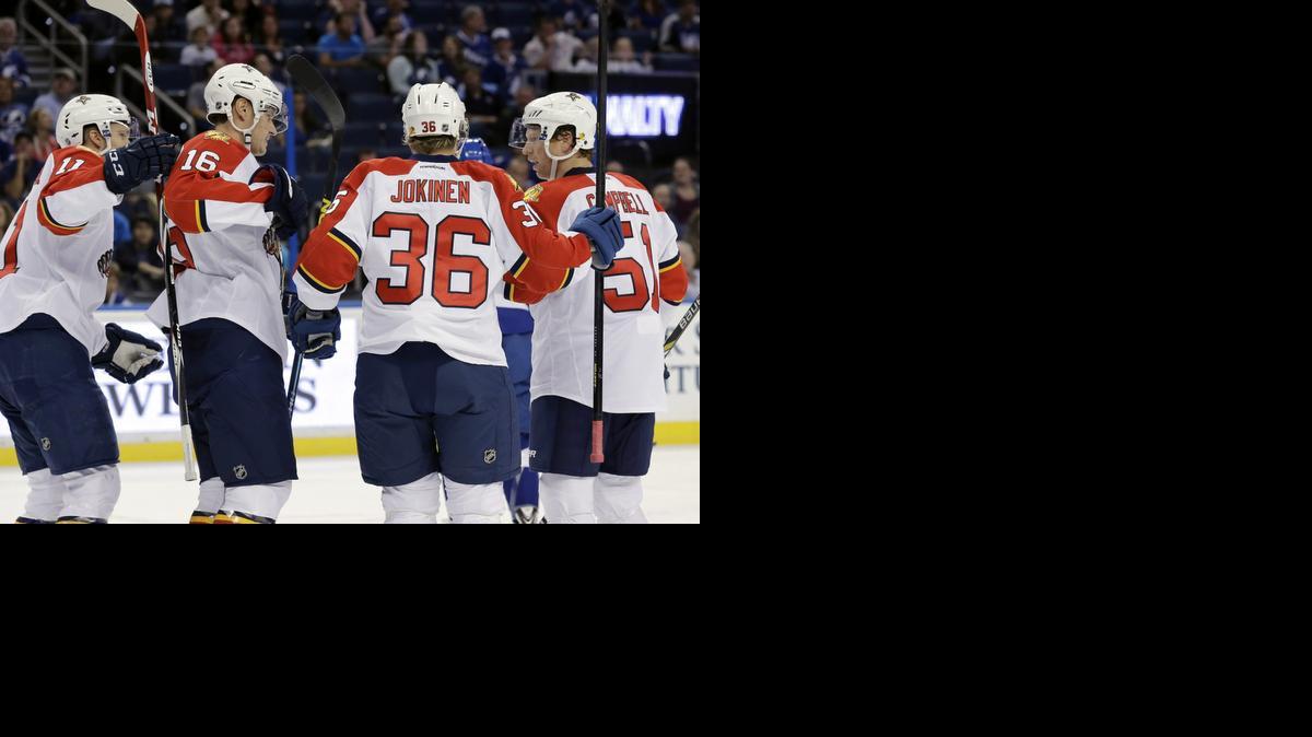 
Florida Panthers center Aleksander Barkov (16) celebrates his goal against the Tampa Bay Lightning with teammates Jonathan Huberdeau (11), Jussi Jokinen (36) and Brian Campbell (51) during the first period of an NHL preseason hockey game Saturday, Oct. 4, 2014, in Tampa, Fla. 
