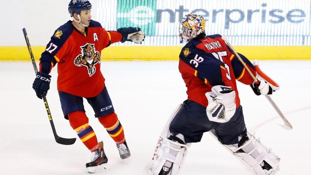 Florida Panthers center Derek MacKenzie (17) and goalie Al Montoya (35) celebrate after the Panthers defeated the Pittsburgh Penguins 2-1 in a shootout Monday, Feb. 15, 2016 in Sunrise, Fla.