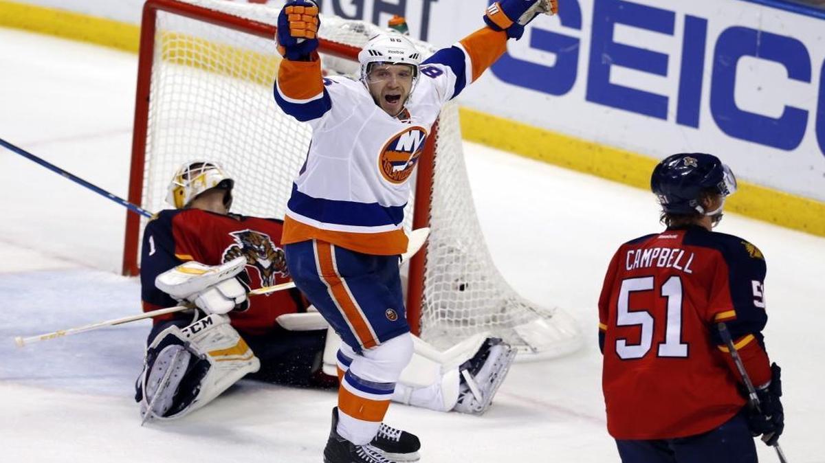 New York Islanders left wing Nikolay Kulemin (86) reacts after center Alan Quine (10) scores in double overtime to win as Florida Panthers goalie Roberto Luongo (1) fails to defend. The Panthers lost to the New York Islanders in Game 5 of the playoffs at the BB&T Center on Fri., April 22, 2016.