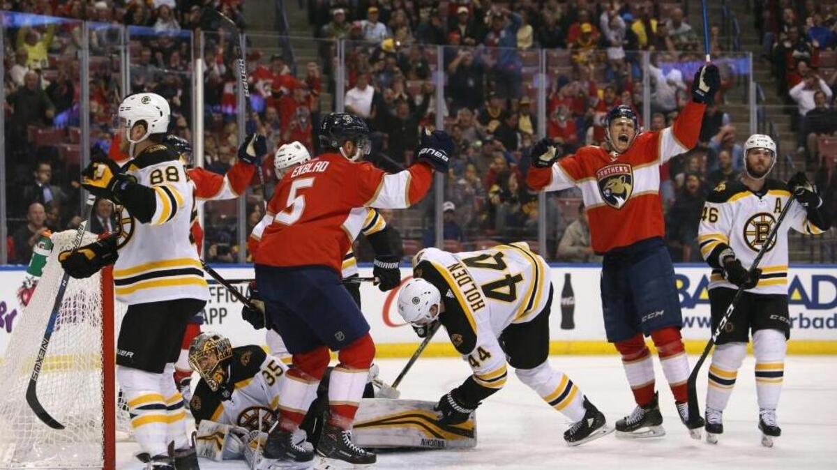 Florida Panthers center Nick Bjugstad (27) reacts after scoring teammate Aaron Ekblad (5) during the first period of an NHL hockey game against the Boston Bruins at the BB&T Center on Thursday, March 15, 2018 in Sunrise.