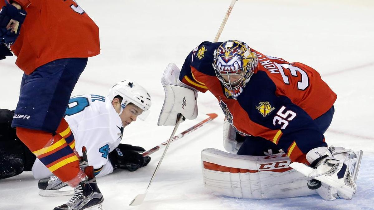 Florida Panthers goalie Al Montoya covers the puck for a first-period save against San Jose on Thursday night.