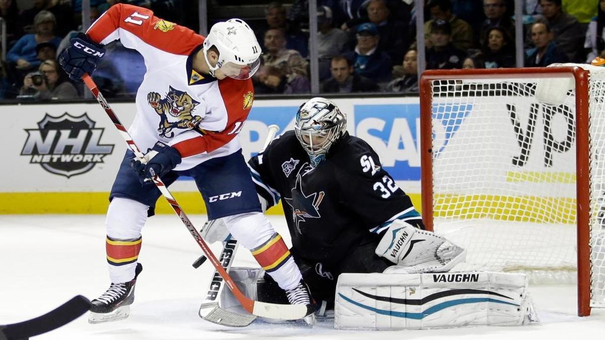 San Jose Sharks goalie Alex Stalock (32) stops a shot from Florida Panthers' Jonathan Huberdeau (11) during the second period of an NHL hockey game Thursday, Nov. 5, 2015, in San Jose, Calif.