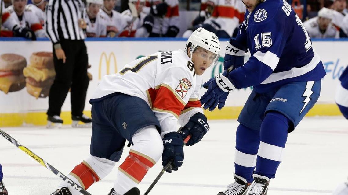 Florida forward Jonathan Marchessault skates around Tampa Bay’s Michael Bournival in a preseason game last month.